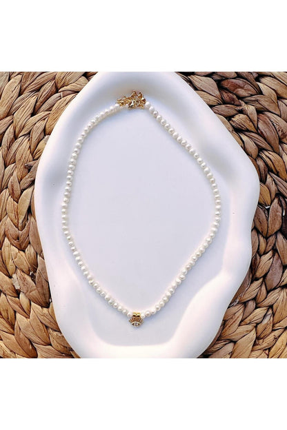 Pearl necklace with eye charm