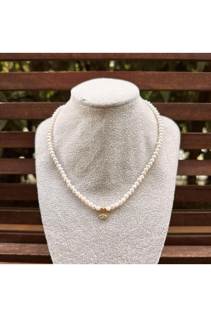 Pearl necklace with eye charm
