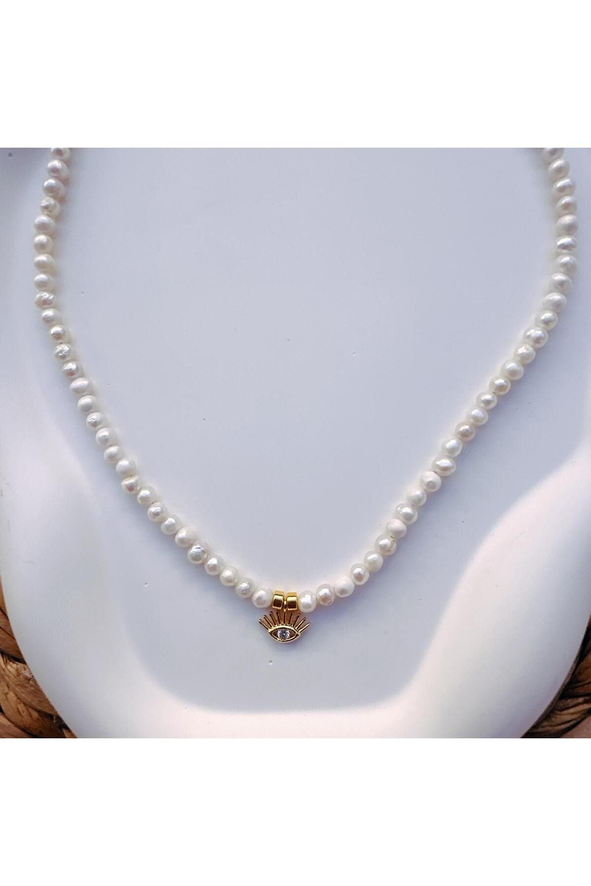 Pearl necklace with eye charm