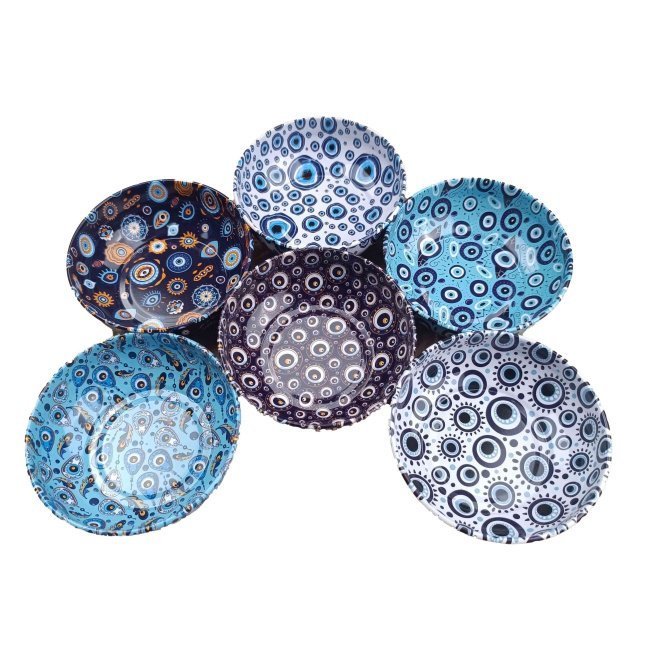 Embossed metal bowl with blue eye pattern, 9.5 cm.